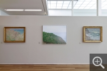 Partial view of the "Les Territoires du désir" exhibition. In the centre, The Valleuse d’Antifer, photograph by Véronique Ellena, displayed alongside Cliffs at Varengeville by Claude Monet, left. © MuMa Le Havre / Charles Maslard